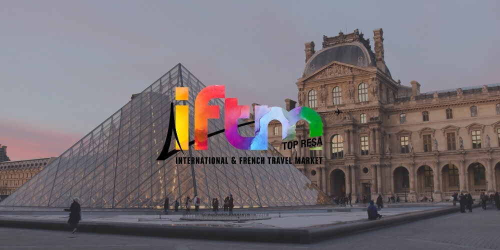 IFTM's logo with Paris in the backrgound