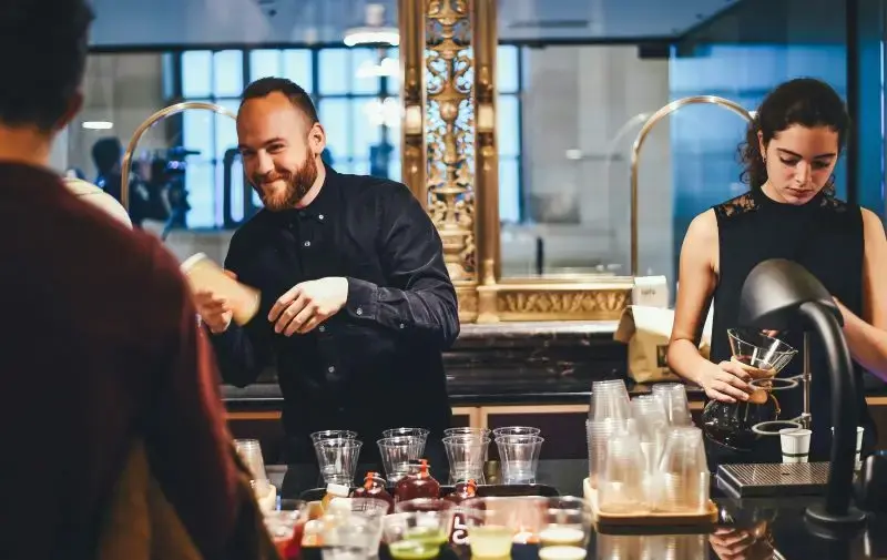 barmaid making drinks