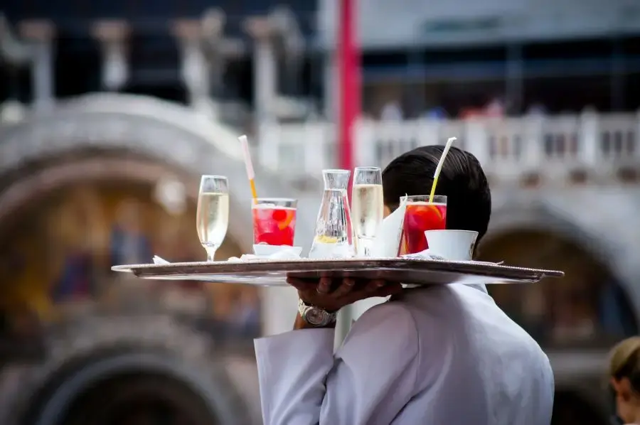 server with a tray and drinks